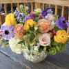 A lovely lush flower arrangement with a rich variety of flowers and