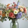 A bouquet of in season florals put together by one of our