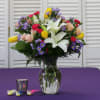 This Dazzling arrangement comes with White Lilies, Yellow Tulips, Hot Pink Mini