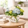 Mighty Hydrangea is a beautiful cream, blue and green Hydrangea bouquet. Arranged