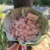 Pink rose bouquet wrapped in sage paper with pearl accents