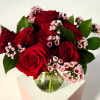 A perfectly petite gesture of love. Fresh roses are artfully arranged in