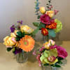 3 petite vases of silk blossoms that look incredibly real.  Great