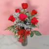 Embrace your feelings with a classic gift of six red roses. Displayed