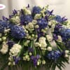 This Casket cover is beautiful in blues &amp; whites. All Holland flowers
