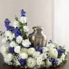 This arrangement has Delphinium, roses, baby&rsquo;s breath, carnations, Mums and greenery. 
