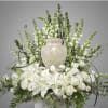 This arrangement has snapdragons, hydrangeas, orchids, Lillie&rsquo;s, tulips, roses and beautiful greenery.