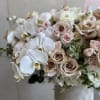 This arrangement features elegant beige nude Quicksand roses with lush garden roses