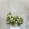 The Always Adored sympathy flower arrangement is a serene, all-white tribute designed