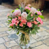 Flourishing assorted pink tones, accentuated with notes of green and lavender. 