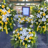 2 standard standing spray, 1picture frame flowers, 1 casket top flowers. Customer