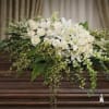 The Garden Elegance Casket Spray from FloralFabulous is a refined and timeless