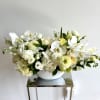 Neutral color tones in this modern and elegant flower arrangement in a