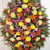 A lively and colorful standing spray designed to celebrate life with a