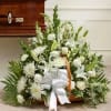A serene and elegant white sympathy floral basket featuring a harmonious mix