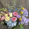 This fun and spring inspired arrangement includes Roses, hydrangea, Mini hydrangea, Sweet