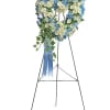"Adorned with trailing ivy, this petite, sweet heart-shaped wreath of sky blue