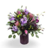 Select this lush arrangement of rich purple and pink florals accented with