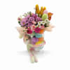 Celebrate the season with this vibrant Easter-inspired arrangement, beautifully designed in a