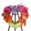Offer a beautiful and memorable tribute with this stunning, heart-shaped floral wreath.