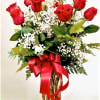 One dozen long stem premium red roses in a glass rose vase.