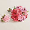 A beautifully coordinated bouquet and boutonniere set designed to complement each other