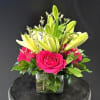 We love this cheerful arrangement!  The combination of colors and flowers