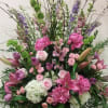 A beautiful variety of pink flowers, accented with lavender and white. Lilies