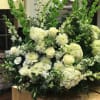 All white flower basket arrangement