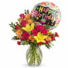 A vibrant birthday bouquet featuring bright yellow lilies, pink roses, and orange