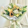 A front-facing bouquet with yellow and green flowers, wrapped in green and