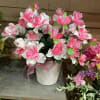 A permanent arrangement with bright pink and white flowers