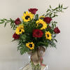 A luscious mix of red roses and sunflowers