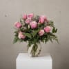 Nothing says romance quite like a dozen pink roses. This classic bouquet