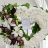 Open heart with elegant assorted of flowers for funeral