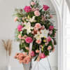 Soft pink standing spray for funeral 