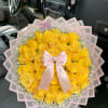 A bright and radiant round bouquet crafted with fresh yellow roses, arranged