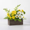 A fresh and uplifting floral design featuring a soft yellow rose as