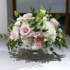 Soft color hues of seasonal flowers design in a mercury glass compote