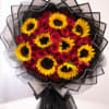 Sunflowers and deep red roses combine for a bold, celebratory statement in