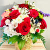An elegant assortment of premium  red roses , accent flowers and