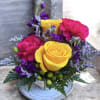 This arrangement has roses, stock, hypericum, limonium, carnations and greenery. 
