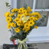 Arrangement measures approximately 13"H 
Send a great big bunch of happiness with