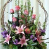 Basket filled with pink and lavender flowers, very gardeny