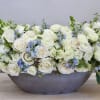 Roses, delphiniums, snapdragons and seasonal greens are elegently designed in our large