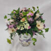 Select this 360&deg; whimsical arrangement featuring ranunculus, carnations and rice flower in