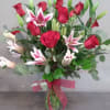A mix of roses and stargazer lilies will fill the room with