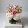 This floral arrangement exudes romance and sophistication with a beautiful  blend