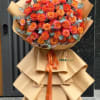 A grand standing flower arrangement that reads as celebration from across the
