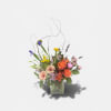 Bright, garden-fresh color greets the eye in this mixed flower arrangement -